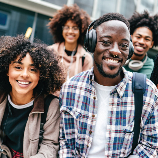 Young adults in a group smiling