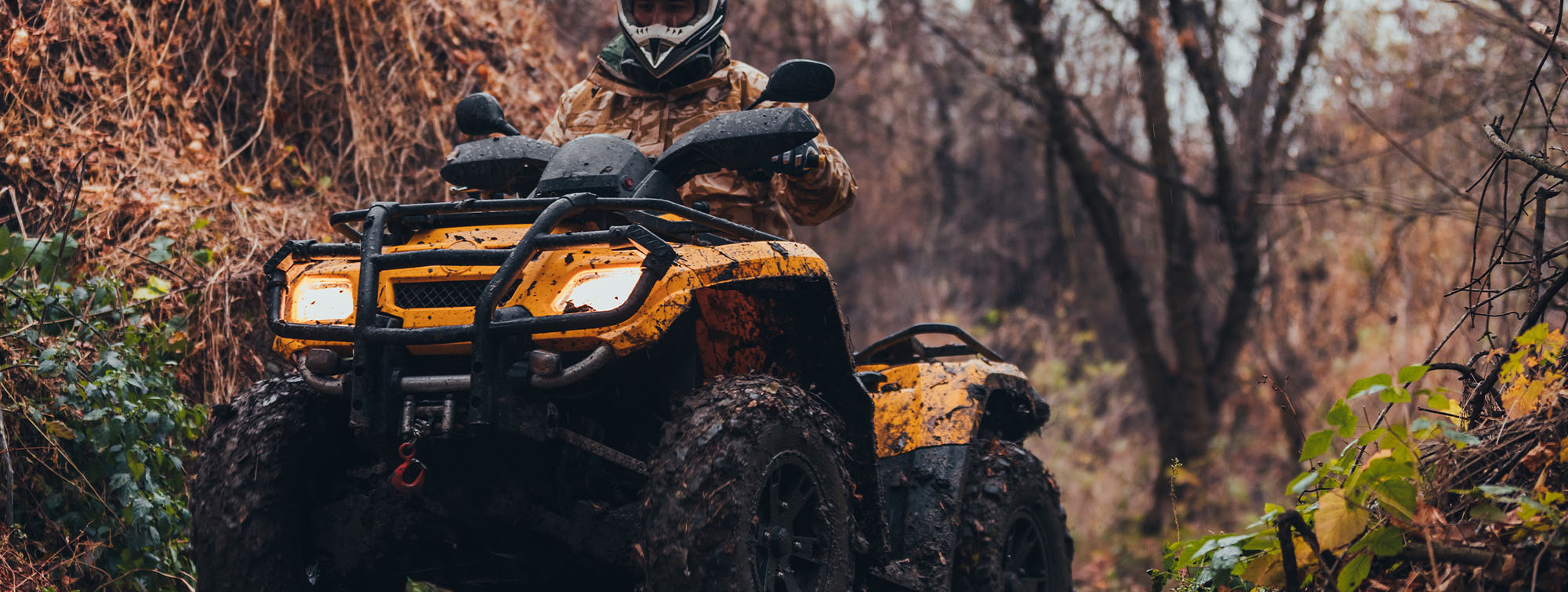 Person driving an all-terrain vehicle