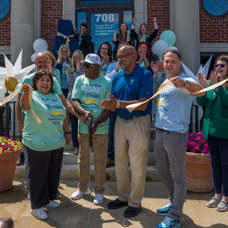 Financial Plus CEO Brad Bergmooser and Board of Directors at Bay City East ribbon cutting.