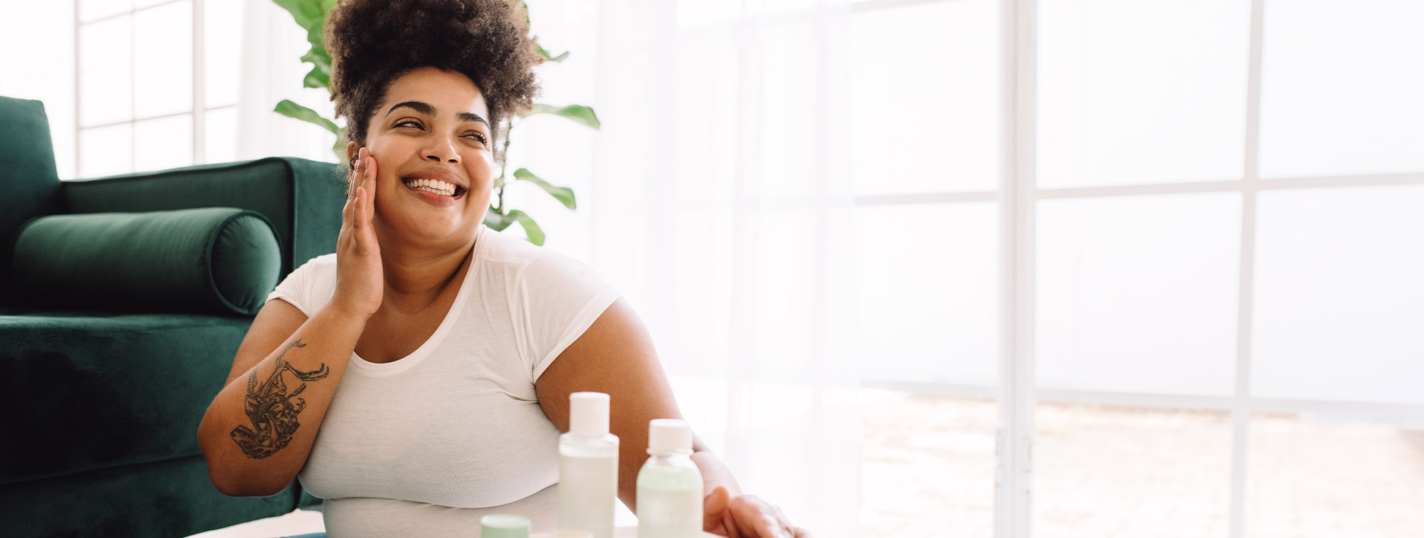 Woman smiling next to couch