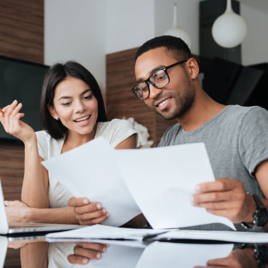 Two people reviewing paperwork