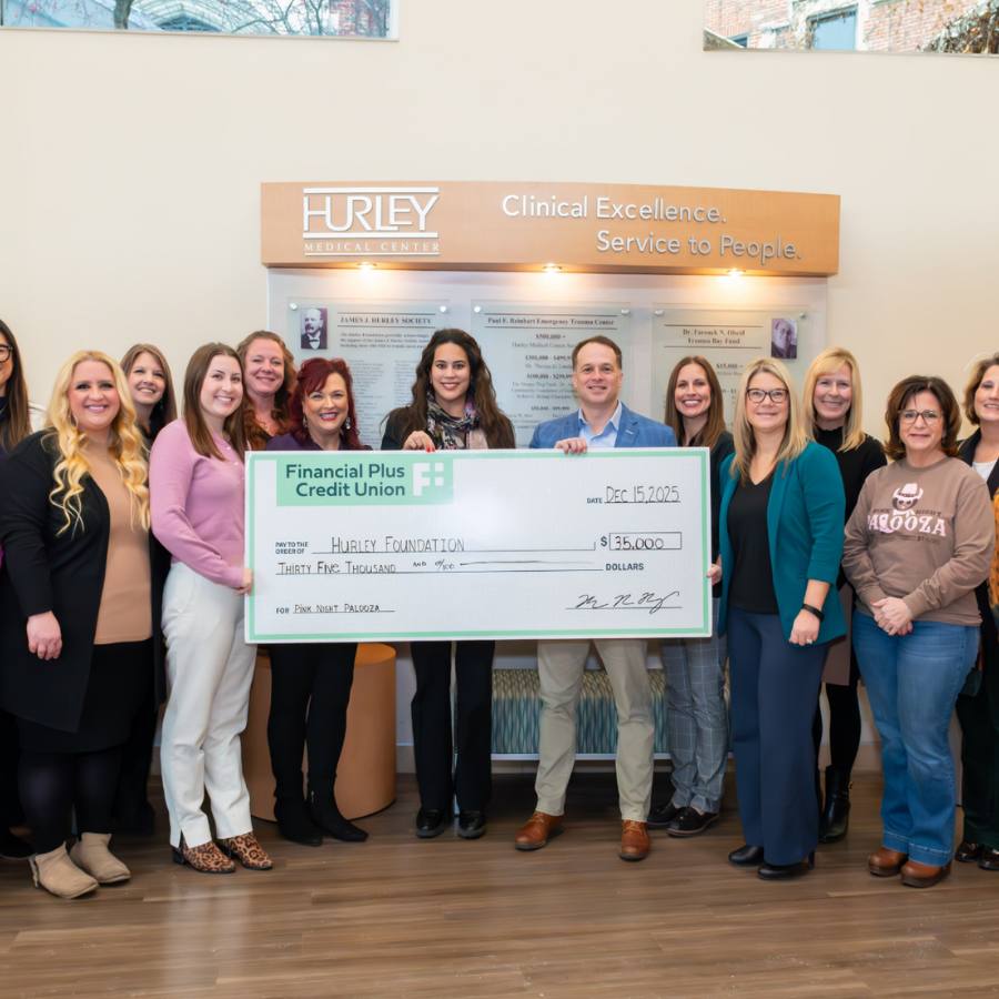 Financial Plus Credit Union team presenting the Hurley Foundation with a check for $35,000.