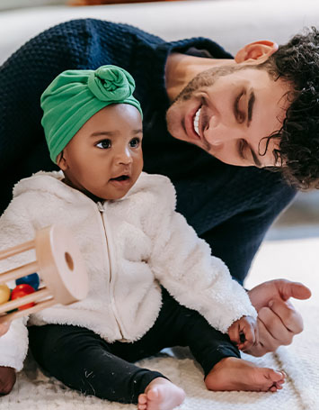 dad smiling with daughter