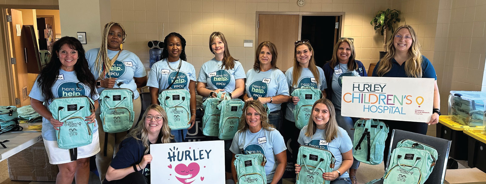 Financial Plus team members volunteering at the Hurley Foundation.