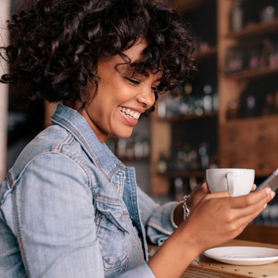 Woman on phone in cafe