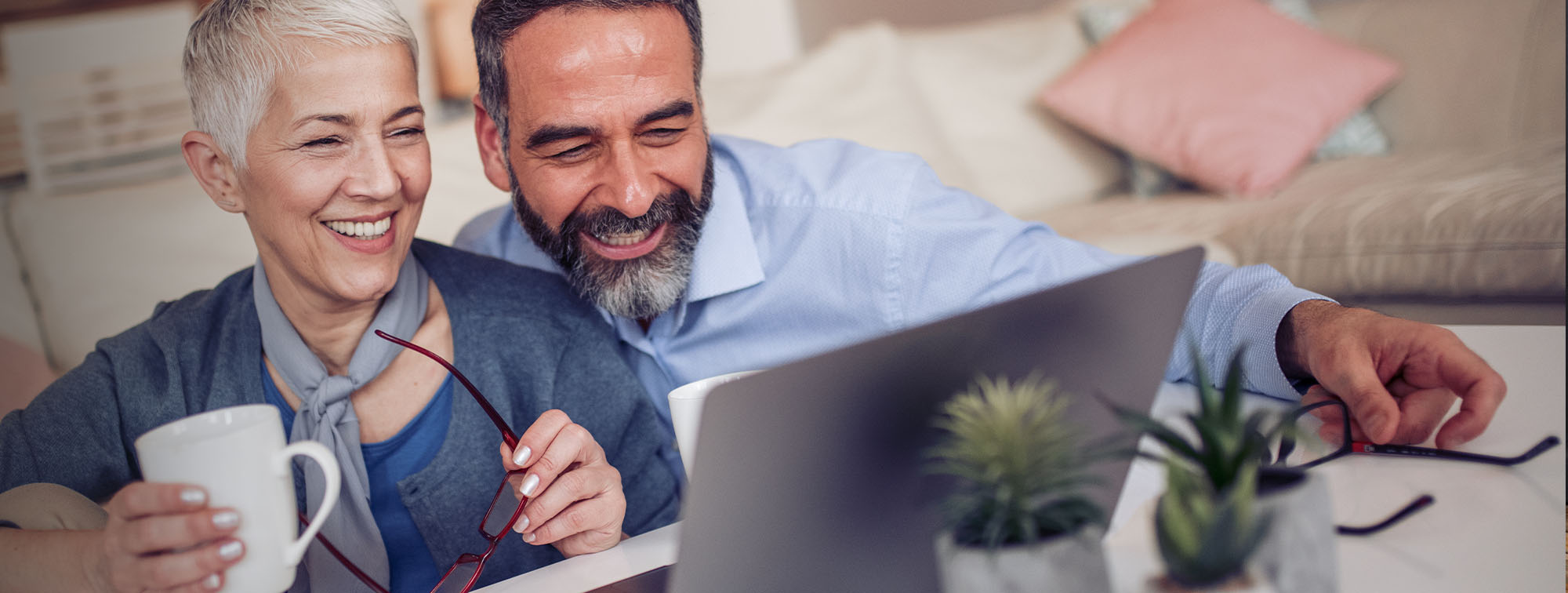 Couple reviewing information together on a computer