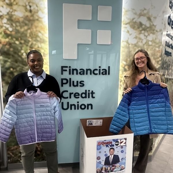 Financial Plus Credit Union employees donating to Coats for Kids