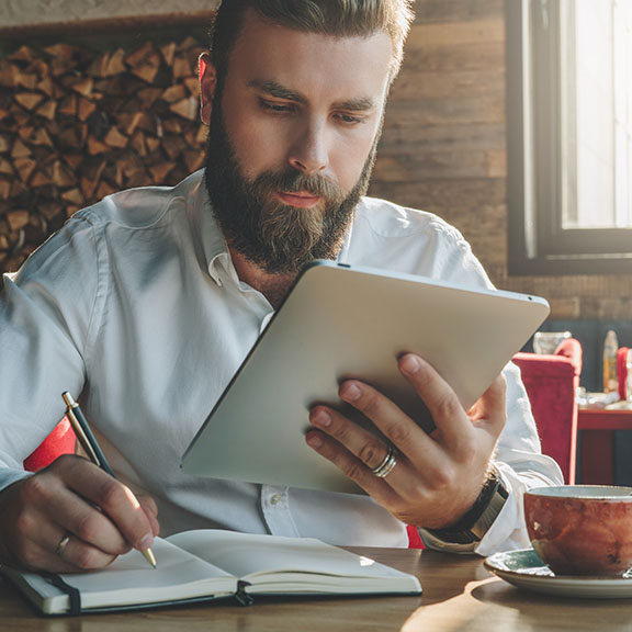 Man learning on his tablet