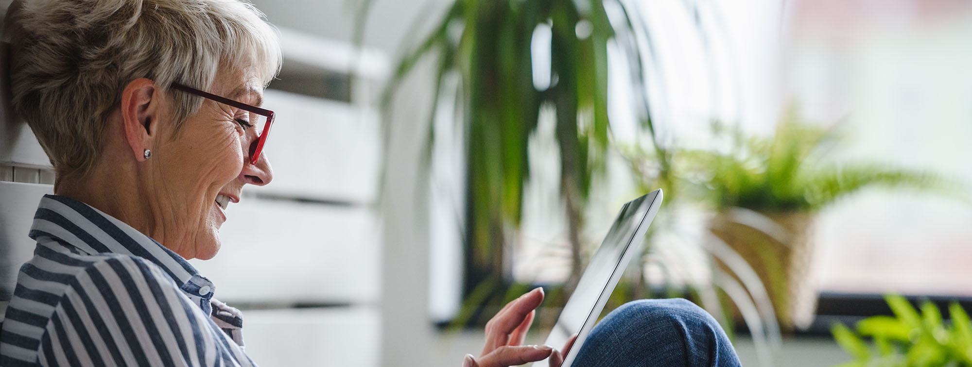 Older woman researching on her tablet