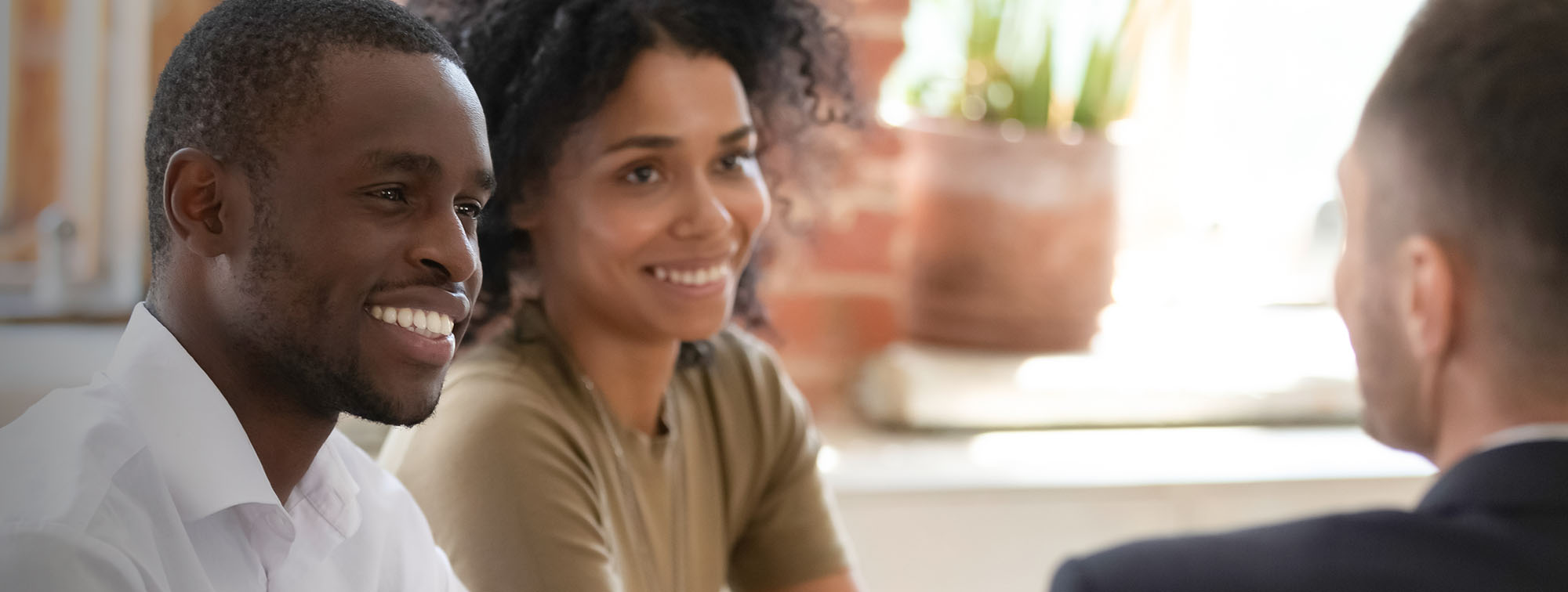 Couple talking to a financial representative