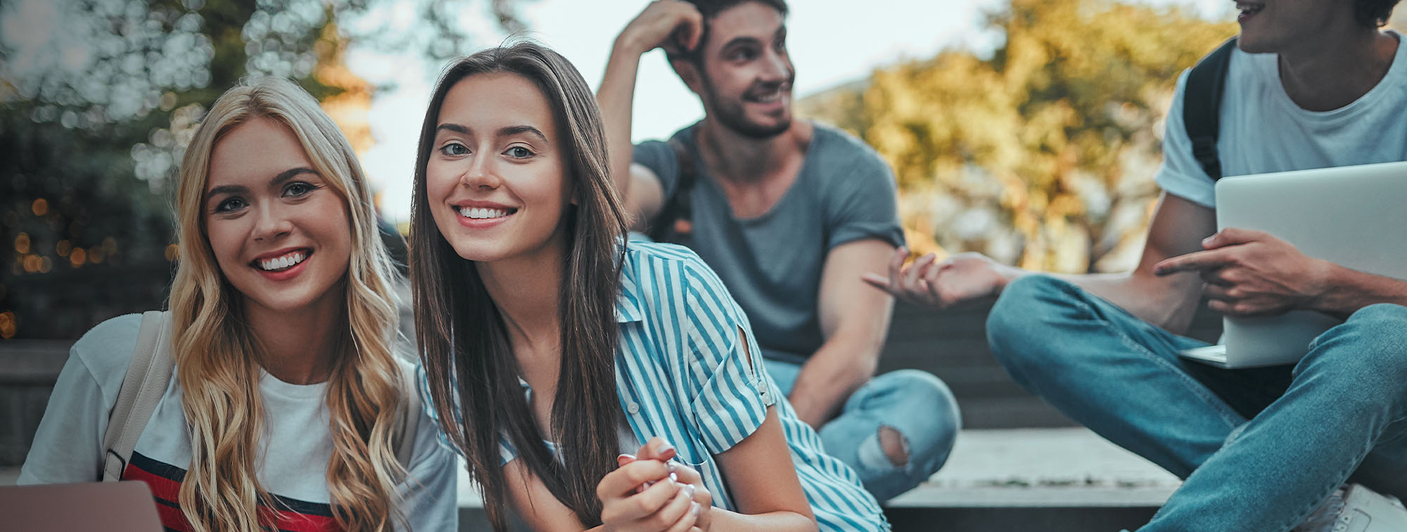 College students sitting together on steps